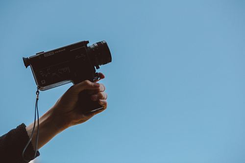 person holding video camera